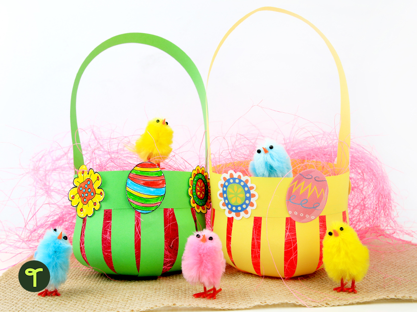 two paper easter baskets sit side by side with toy chicks around them and a piece of burlap on the table below them