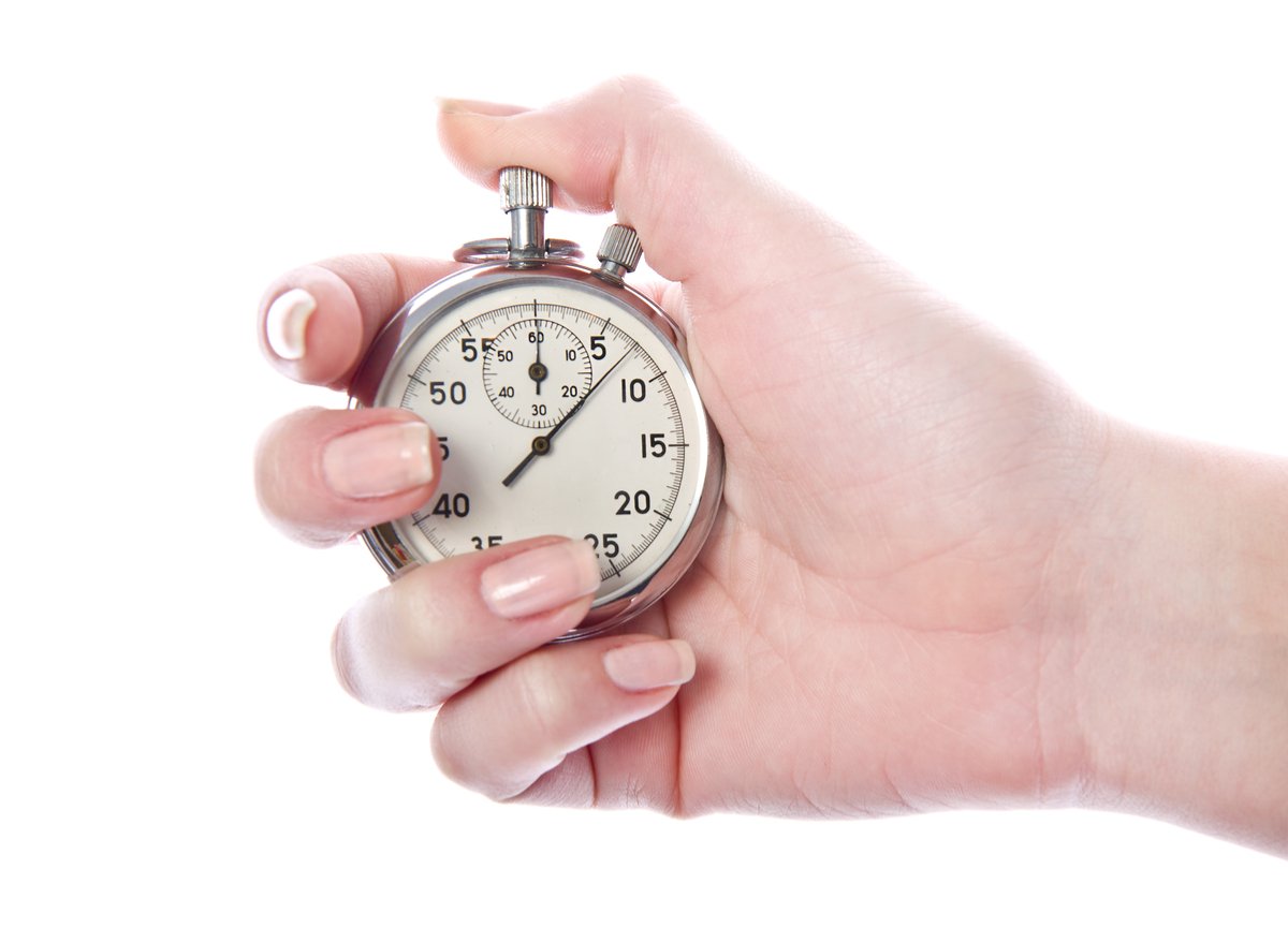 Hand holding a stopwatch - does the Pomodoro technique work for teachers? Yes!