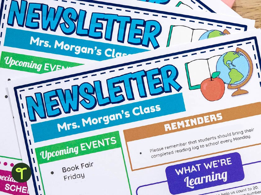 classroom newsletters are piled up on a teacher's desk