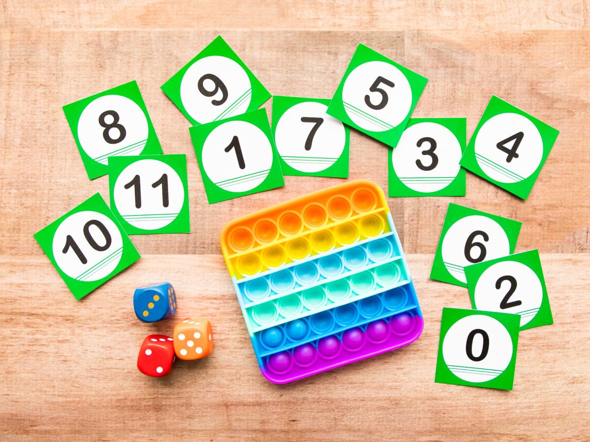 Pop It subitizing activity with dice and number flashcards