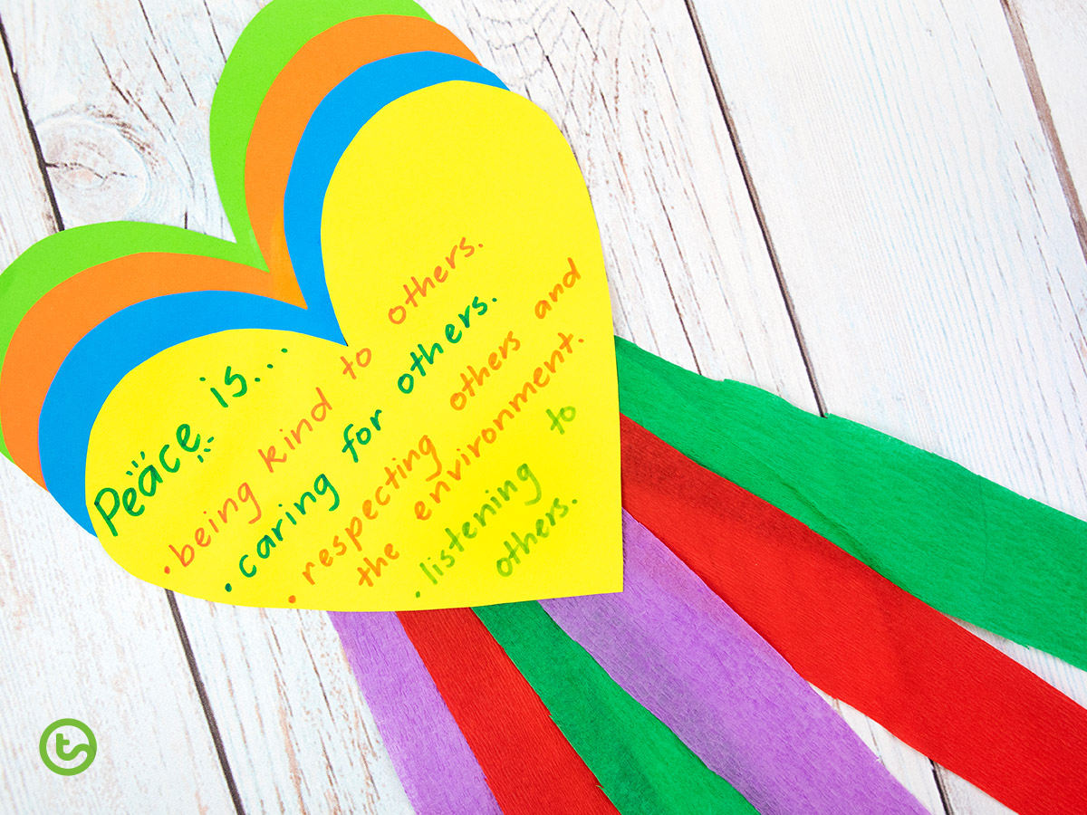 Peace day craft activity for students featuring colored paper hearts and streamers