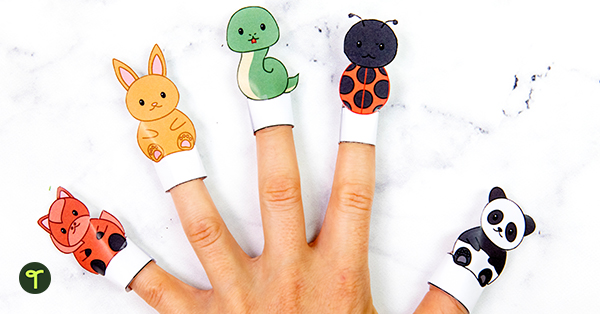 animal finger puppets are seen on a teacher's hand