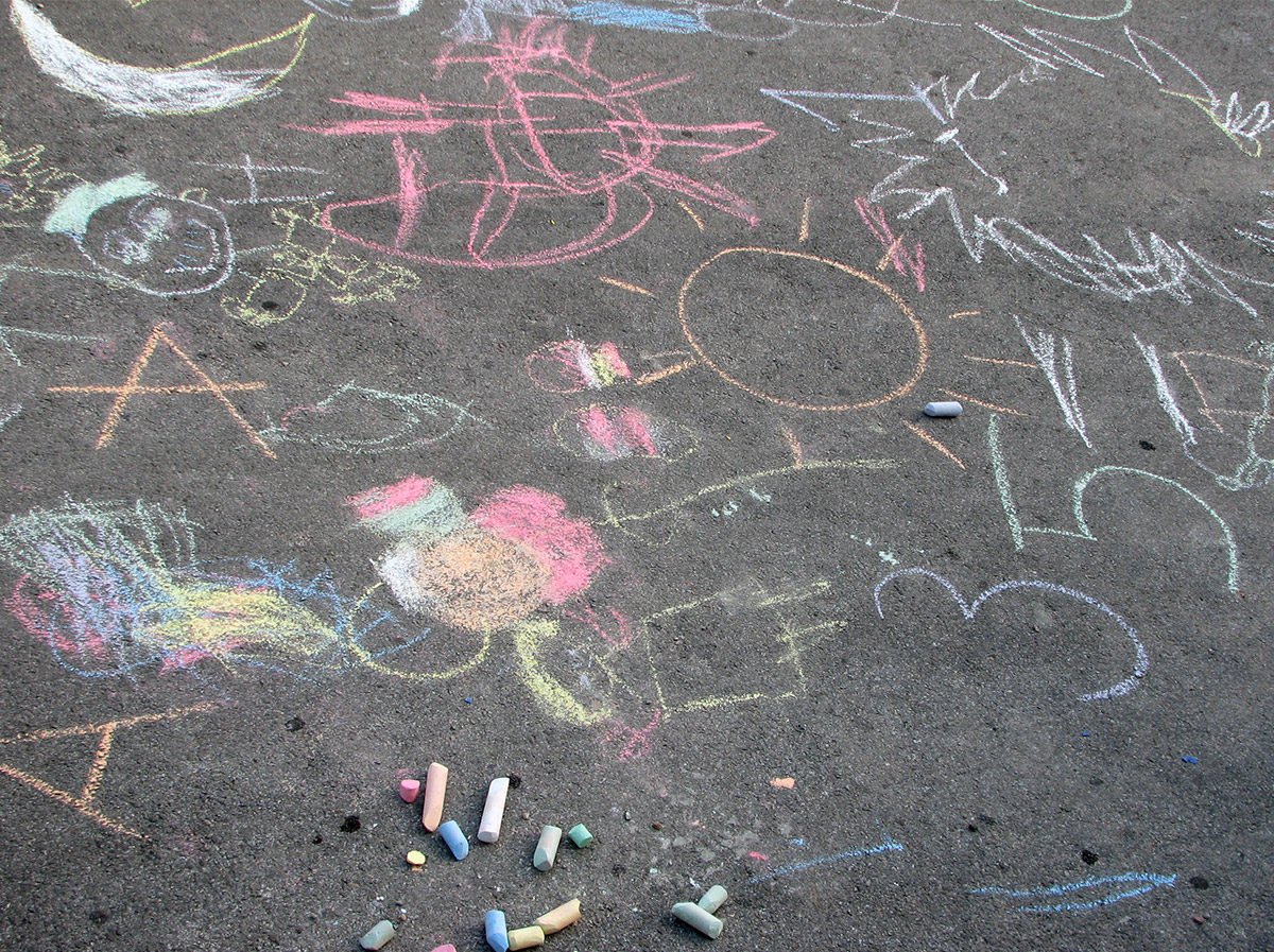 Chalk drawings on cement by child.