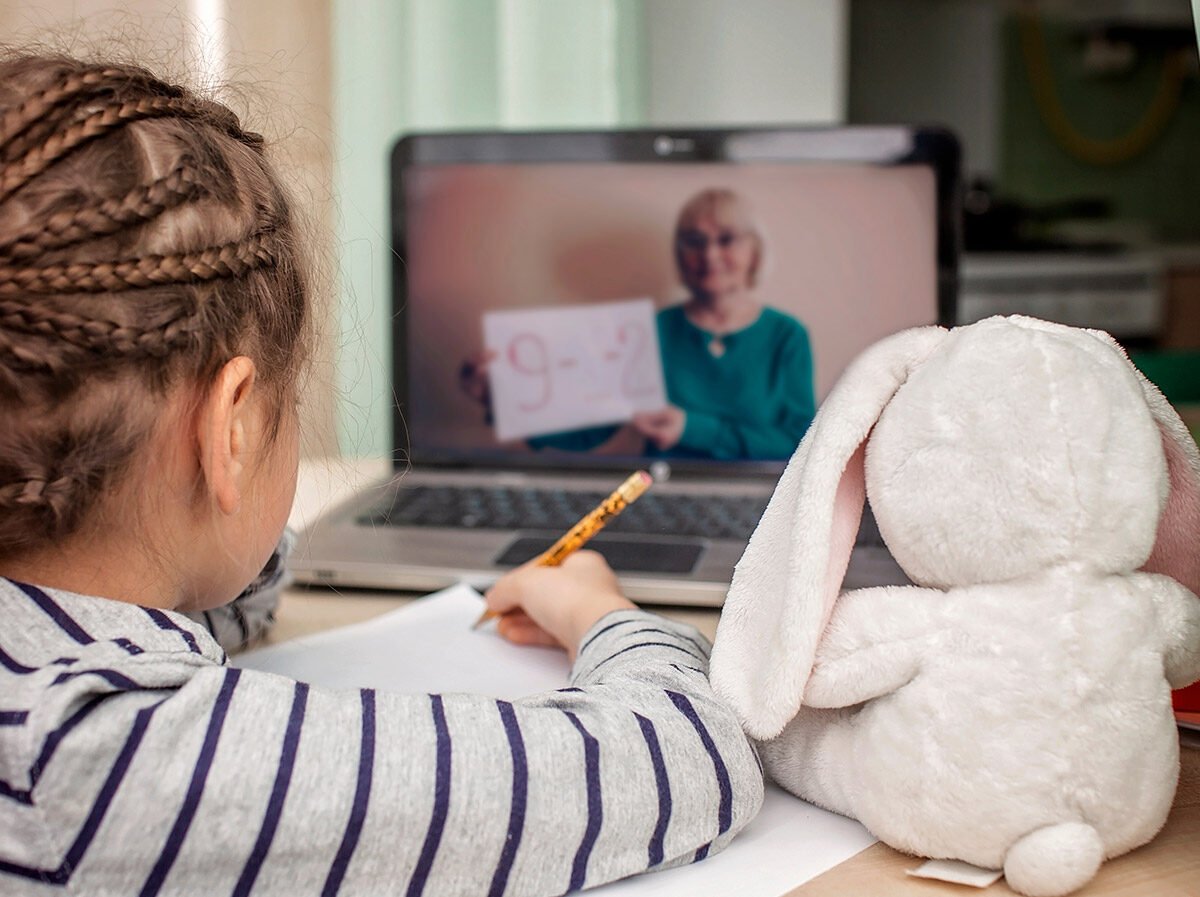 Student watching a teacher on a video