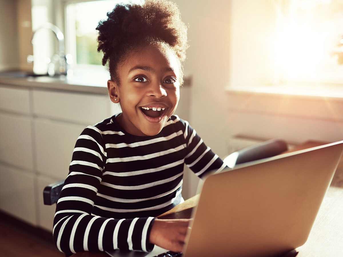 Girl excited to get a message from teacher during distance learning