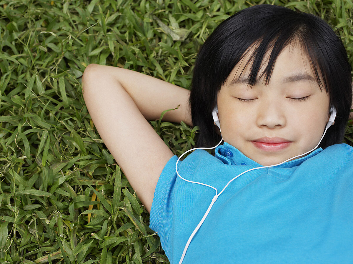 Child relaxing on the grass