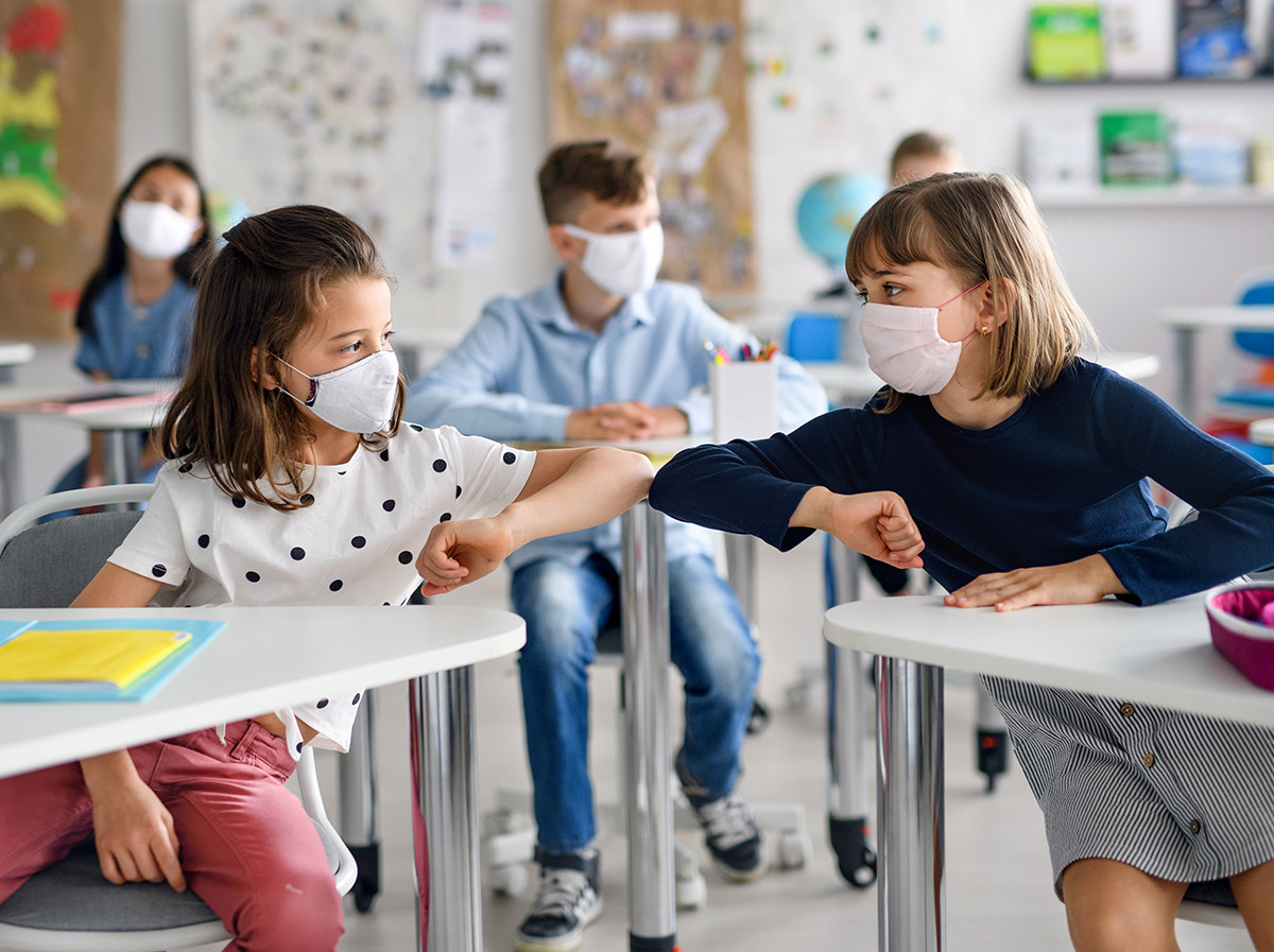 Kids elbow tapping in classroom