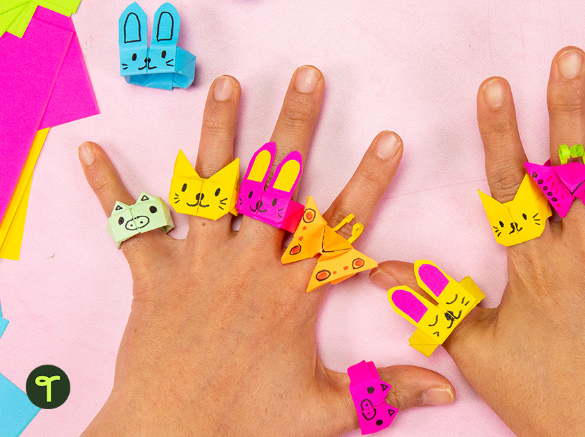 origami animal rings on hands