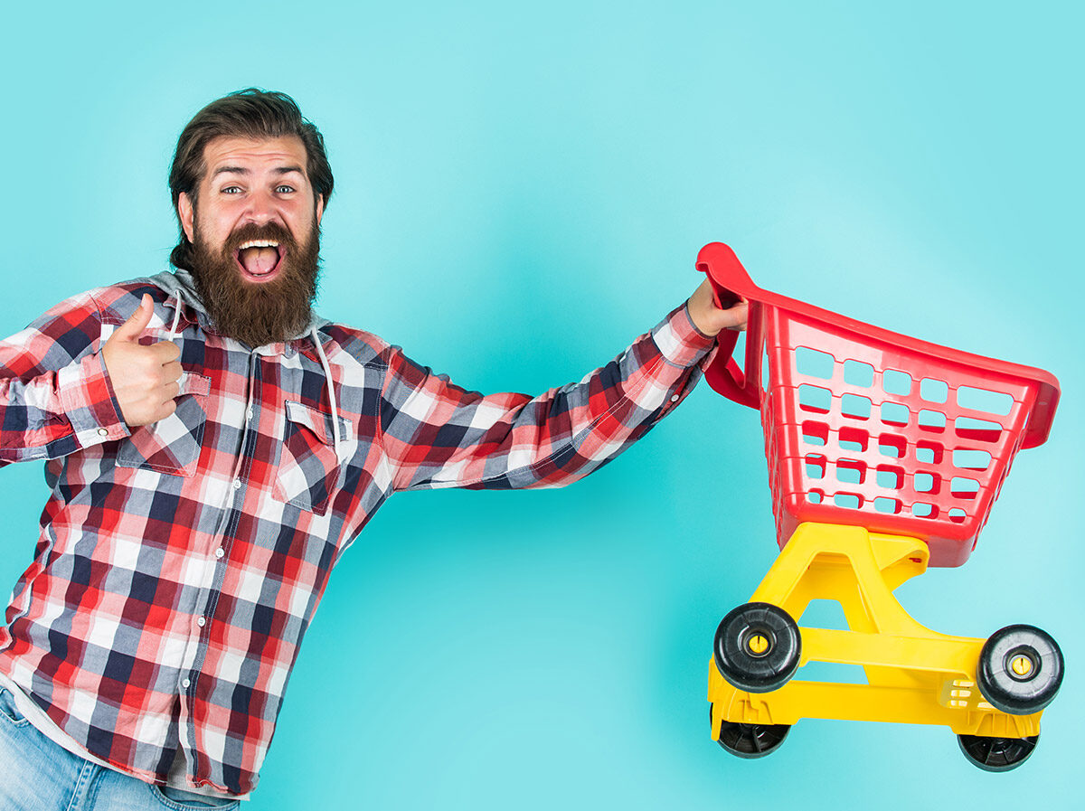 Man holding a toy trolley