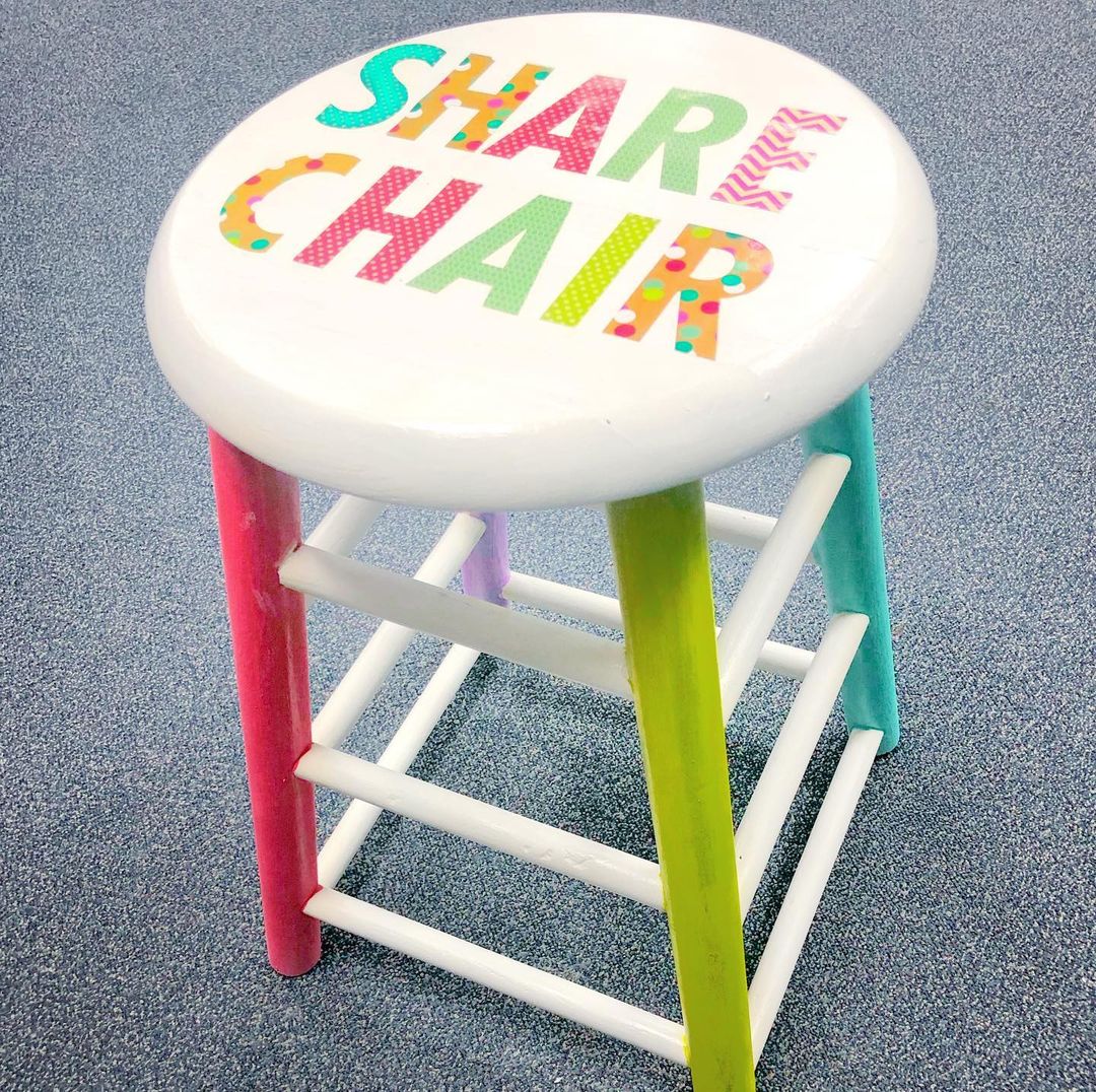 stool with the words share chair painted on it