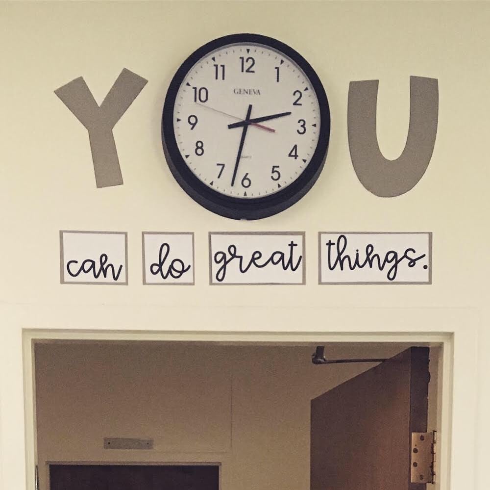 the words you can do great things on a classroom wall with a classroom clock forming the o in the word. you