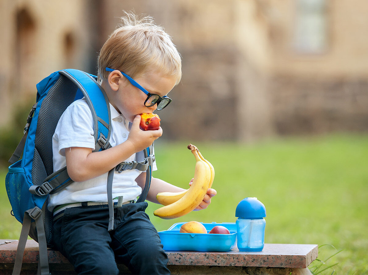 boy-eating-fruit-at-school