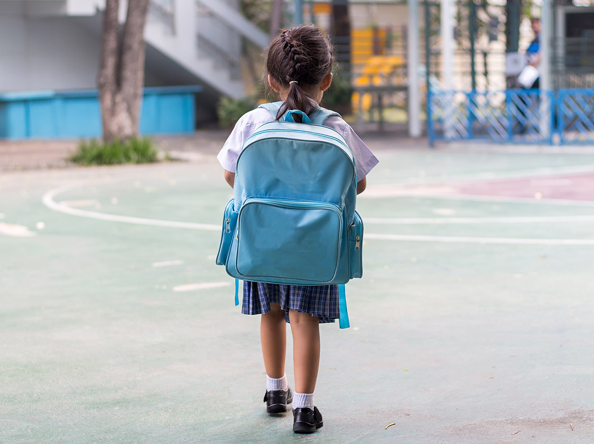 girl-walking-back-to-school-after-remote-learning