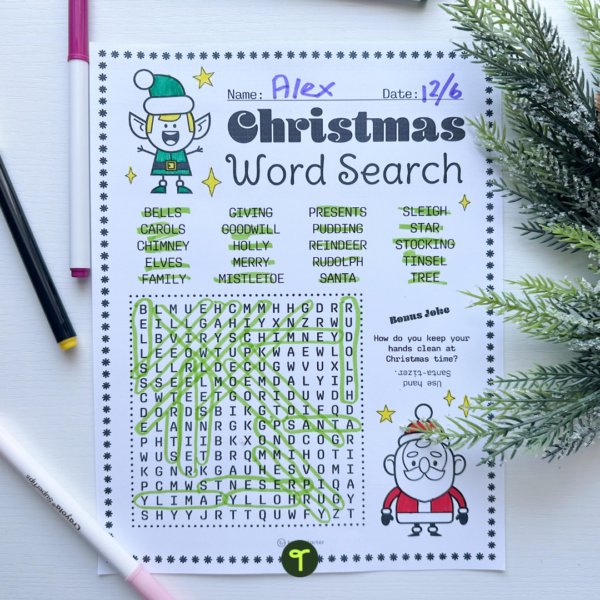 Christmas Word Search on table with pens