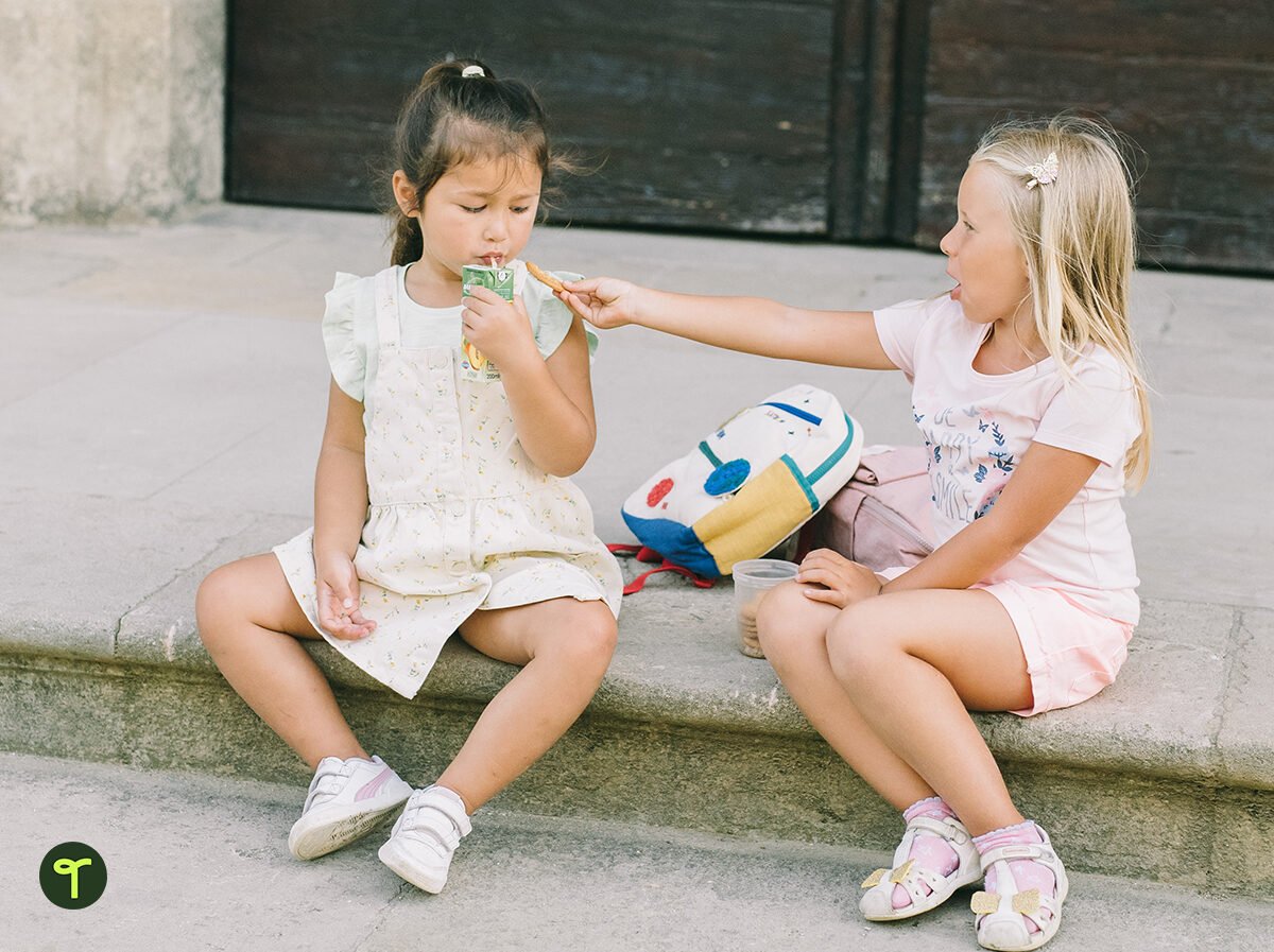 little girls resolving conflict by sharing food