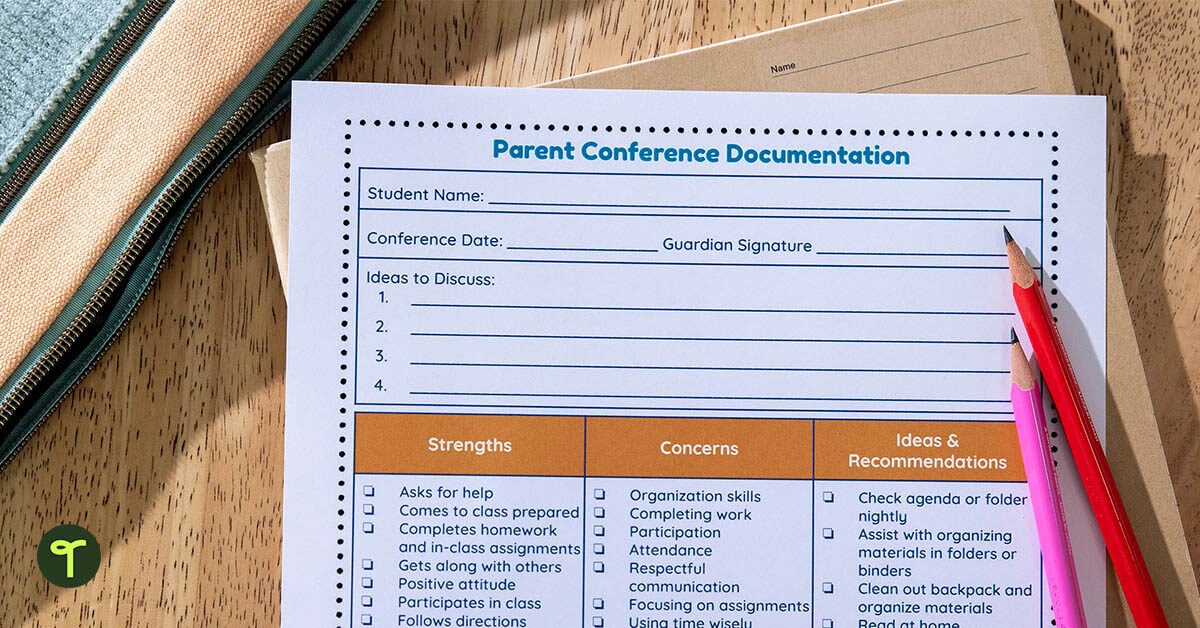 a parent teacher conference documentation form sits on a teacher's desk with pencils on it