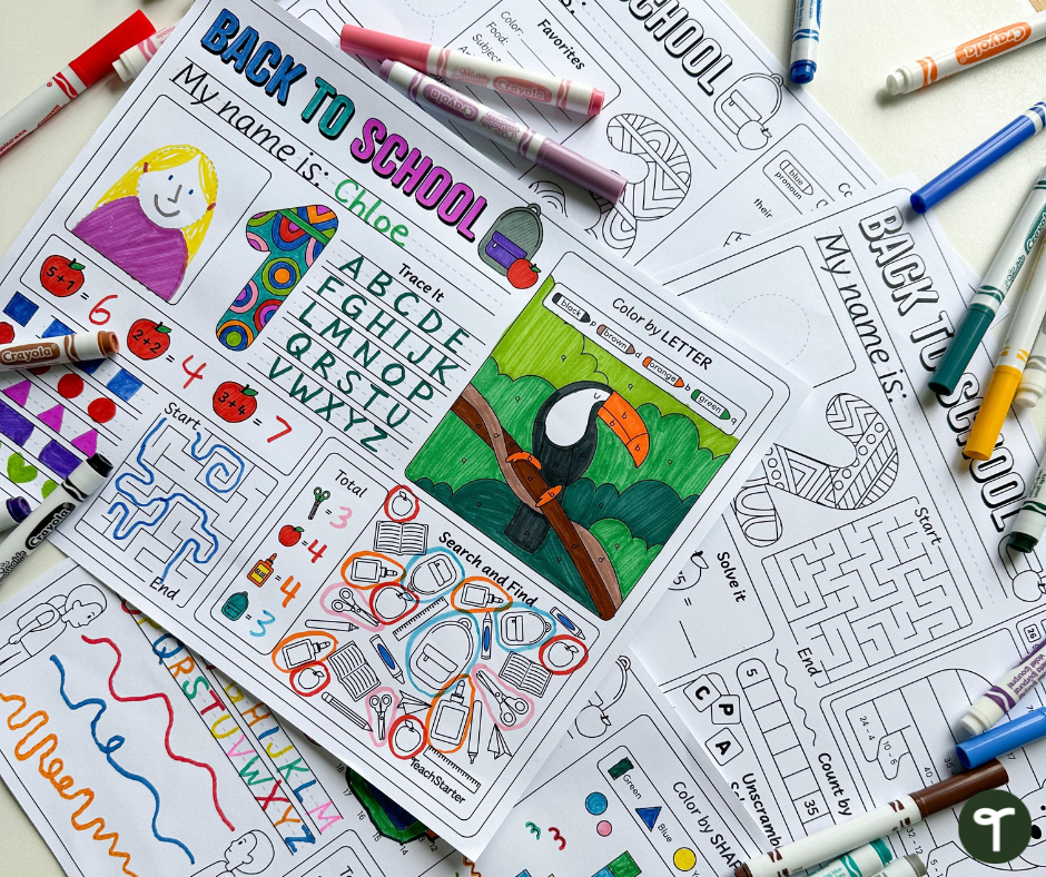 Back to School Activity Mats on table with Crayola markers around them