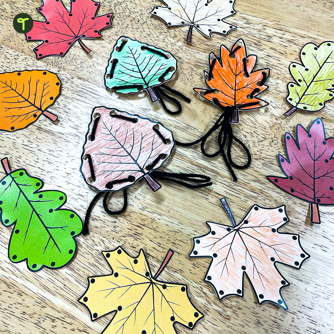 Fall Leaf Lacing Cards on table with black yarn
