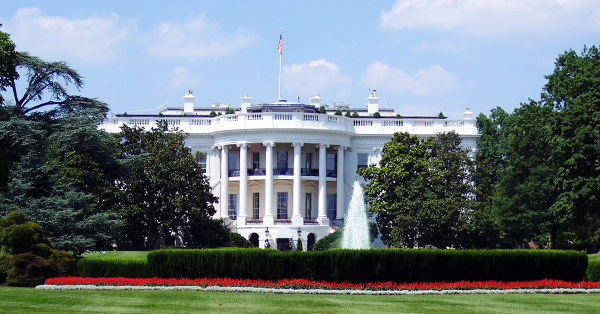 the white house is seen from its front lawn in washington dc