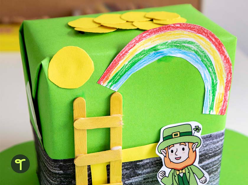 green box with rainbow, gold coins and a leprechaun built to trap leprechauns by a kid