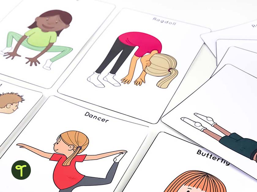 printed yoga for kids cards laid out on a white table