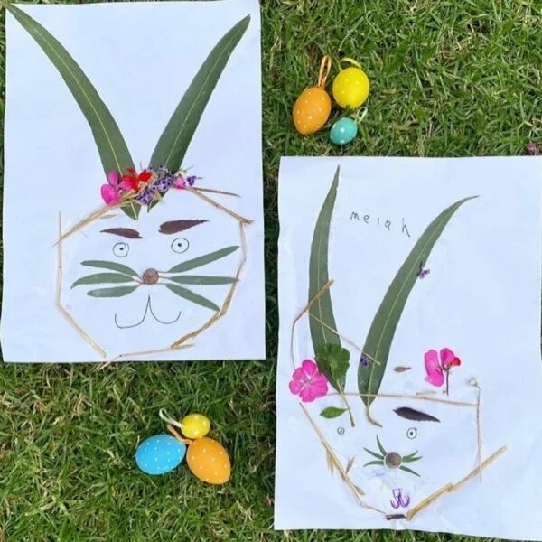 Plants assembled in bunny shapes on paper with grass background