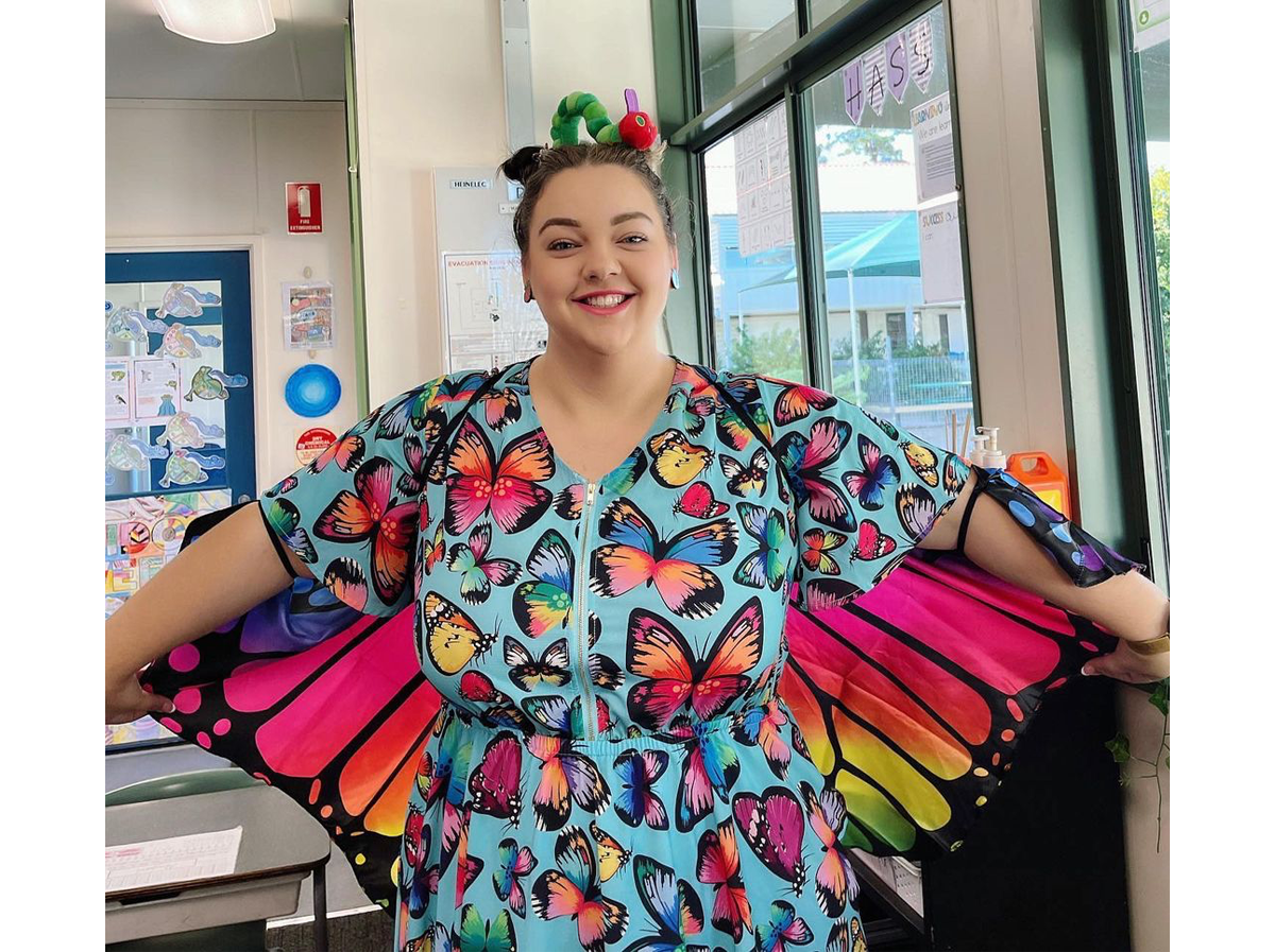 A woman dressed in a butterfly dress wth wings for Book Week 