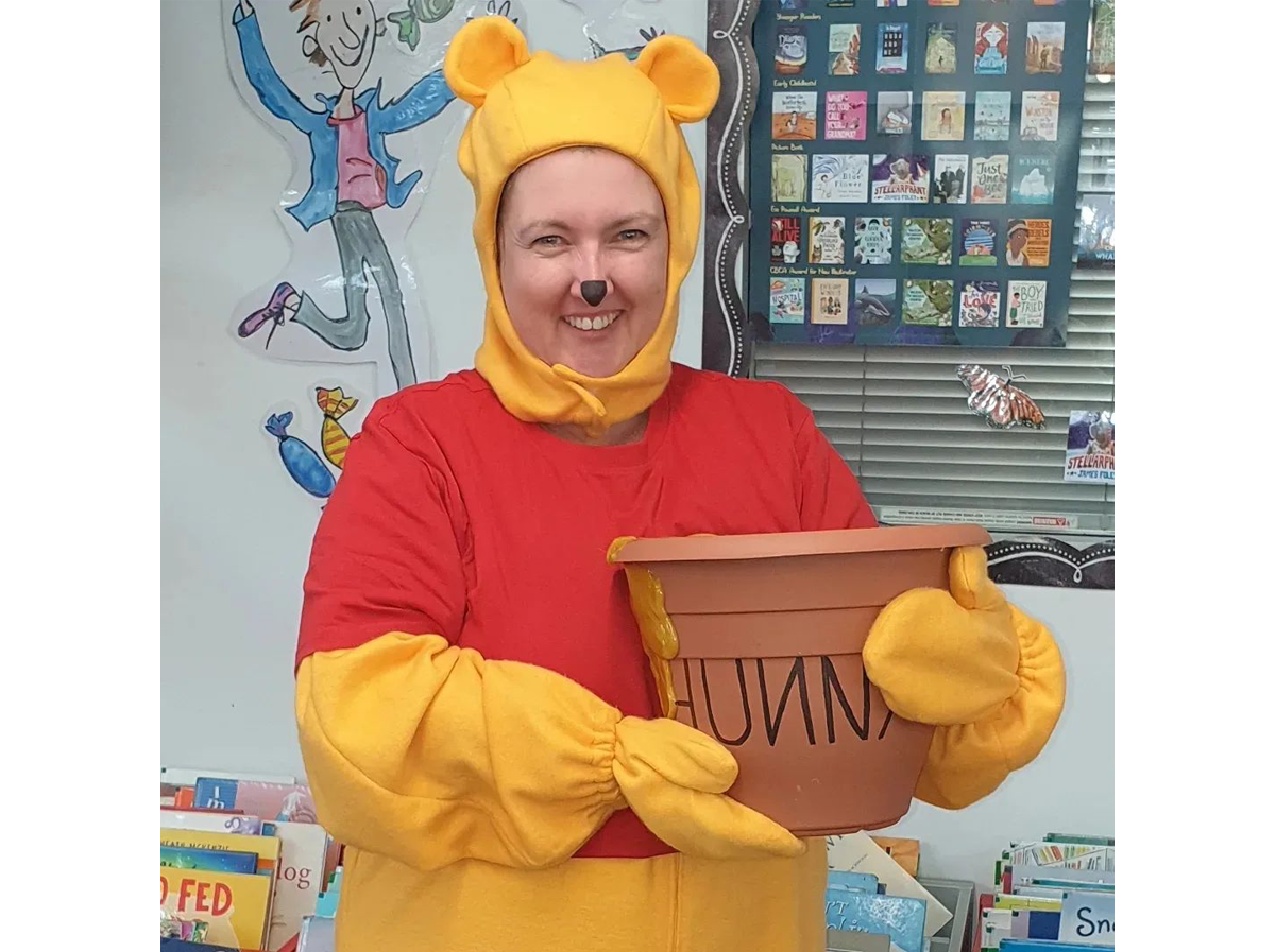 A woman dressed as Winnie-The-Pooh for Book Week