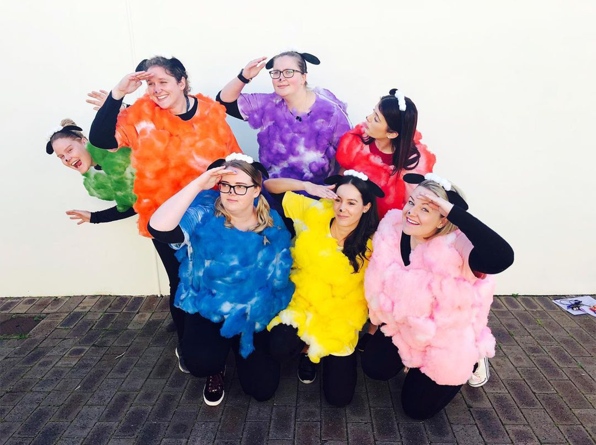 Seven women in colourful sheep costumes for Book Week 
