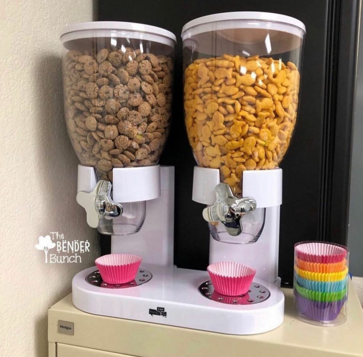 Snack dispensers with cereal and goldfish.