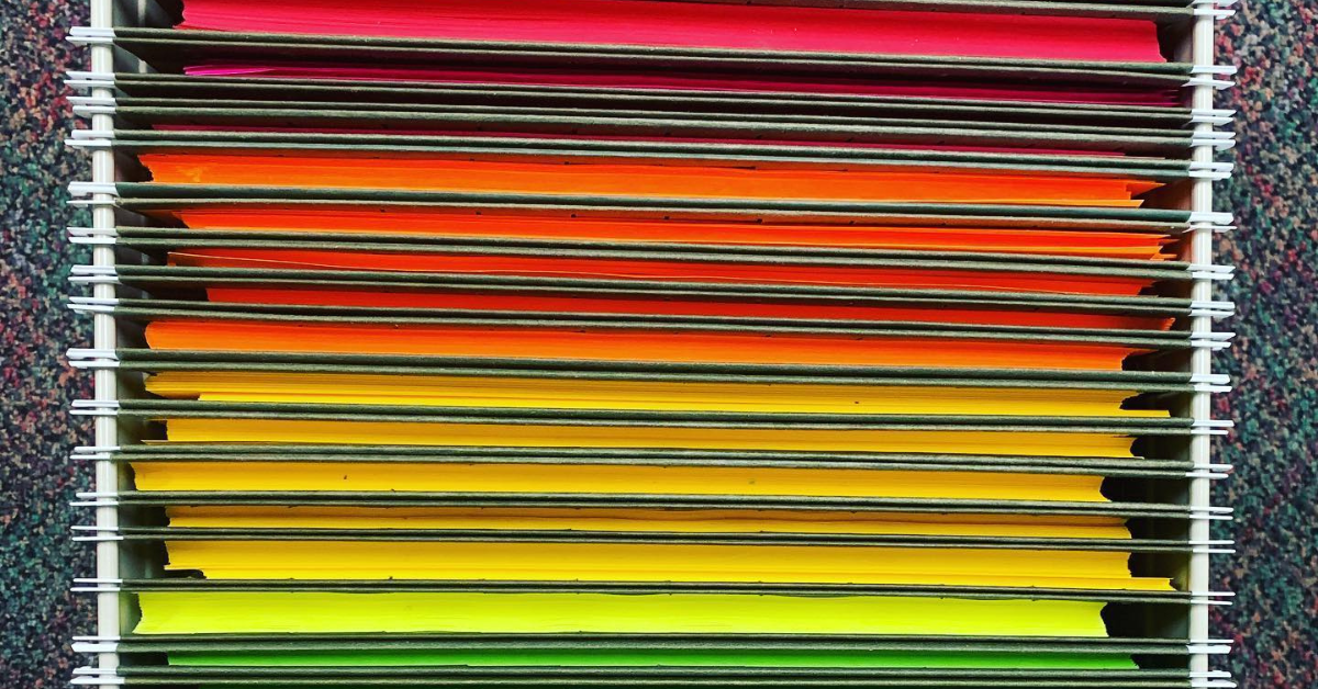 Colorful construction paper in file