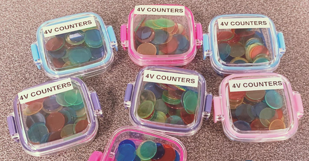 Plastic counters in Tupperware boxes