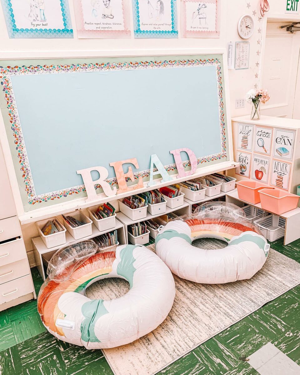 Rainbow classroom library with inner tube chairs