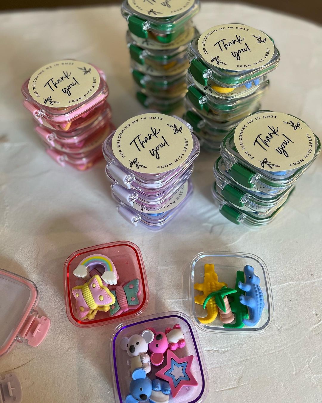 Kmart hacks for teachers: colourful erasers in little plastic containers with a sticker reading 'Thank you!'