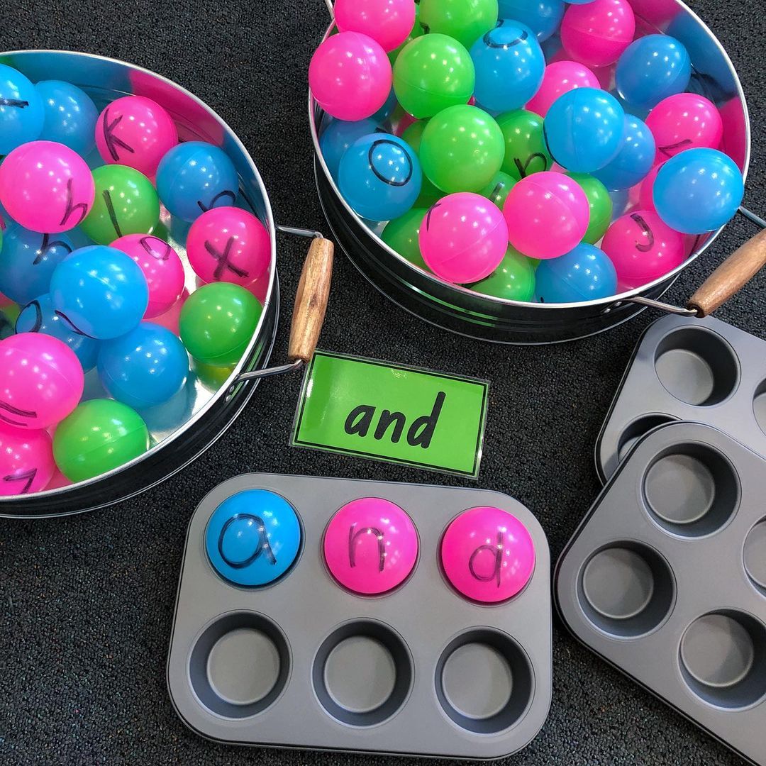 Kmart hacks for teachers: coloured balls with letters on them in muffin trays.