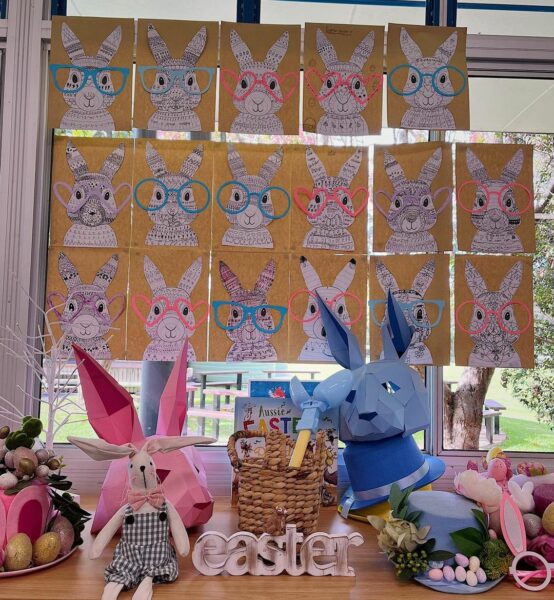 A classroom window display with Funky Easter Bunny colouring hanging on it